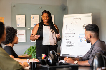 african american woman presenting project at meeting in the office. .