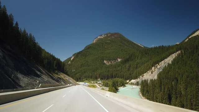 YOHO NATIONAL PARK, BC, CANADA - JULY 2019: Smooth Gimbal Driving by Kicking Horse Rest Area & River of Yoho National Park in British Columbia, Canada