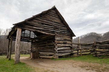 Fototapeta na wymiar old log stable house in the national park