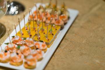 buffet food, catering food party at restaurant, mini canapes, snacks and appetizers
