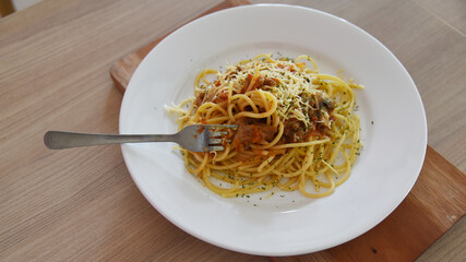 Spicy spaghetti with cheese served on the table. Photo concept for commercial use