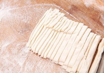 Hand rolling noodles