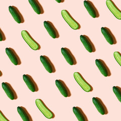 Cucumbers pattern creative on pink background. Top view, flat lay style