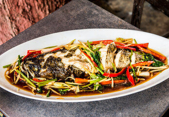 Steamed  goby  fish with sauce  in pan, Thai famous food.