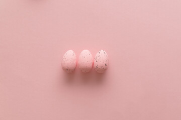Pink eggs on pastel pink background. Happy Easter. Top view. Flat lay.