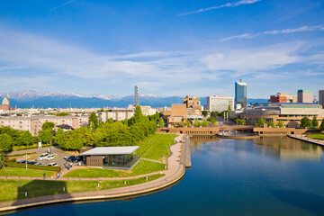 Toyama cityscape and Tetayama mountain range (Japan alps) views from Kasui park in Toyama city, Toyama, Japan.