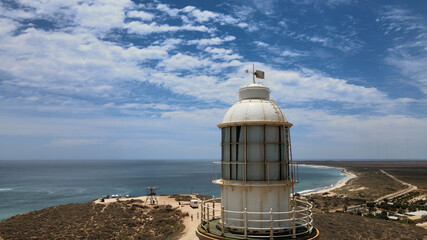 Head of high old historical lighthouse at a hill next to Indian Ocean near Exmouth, Western...