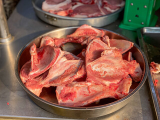 Pile of pork bone for sale at raw meat market 