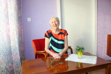 The portrait of a cheerful senior woman
