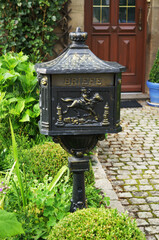 Vintage mailbox in the courtyard of a village house