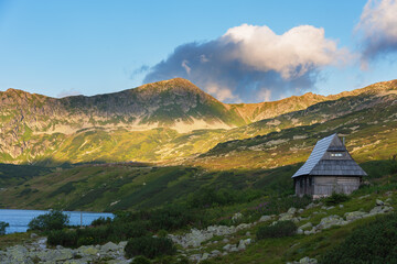Beautiful views of the Polish High Tatras with mountain lakes and picturesque houses in the summer season