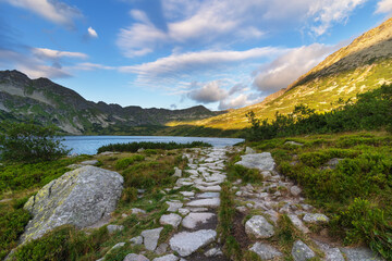 Beautiful views of the Polish High Tatras with mountain lakes and picturesque houses in the summer season