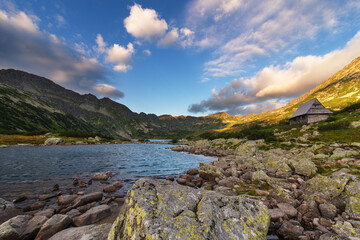 Beautiful views of the Polish High Tatras with mountain lakes and picturesque houses in the summer season