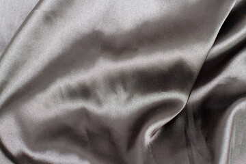 wavy material of Gray elegant silk fabric wrinkled textured background