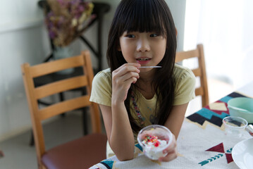 Asian child cute girl Eat ice cream home made