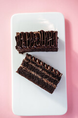chocolate brownie on pink background