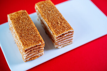 Honey cake on a red background