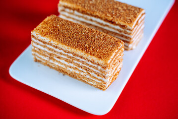 Honey cake on a red background