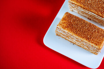Honey cake on a red background