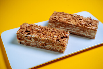 Honey cake on a yellow background