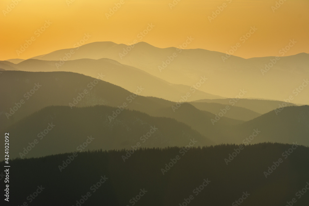Wall mural beautiful sunrise in the carpathian mountains with fog and dramatic sky
