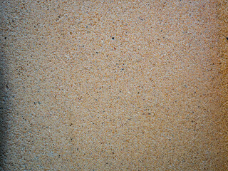 Texture fine brown sand and small gravel