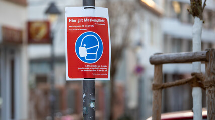 German letters, advice to wear mouth protection or face mask from 10am to 10pm in this city area, outdoors