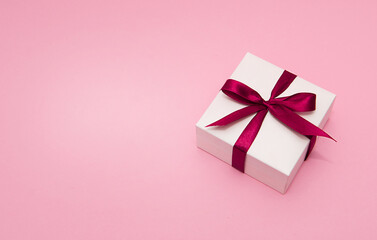 White Gift box with red ribbon and copy space