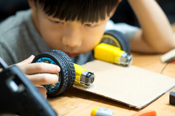 Science, Technology, Engineering and Mathematics (STEM) education concept. Closeup of an adorable...