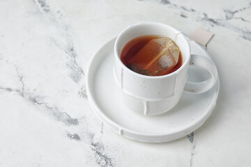 Cup of tea on light background