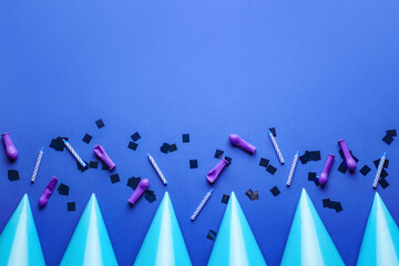 Composition with party hats on color background