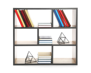 Modern shelf unit with books and decor on white background