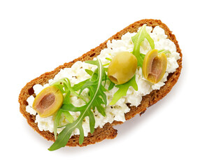 Bread with cottage cheese, olives and arugula on white background