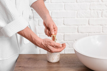 Man washing hands in bathroom