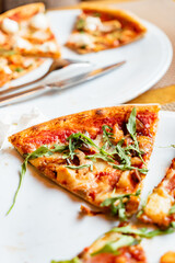 friends eating pizza in a indoor cafe