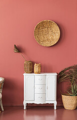 vintage chest of drawers near pink wall