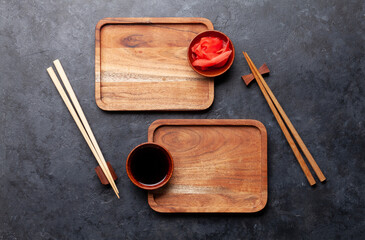 Fototapeta na wymiar Wooden plates and chopsticks for your sushi and maki