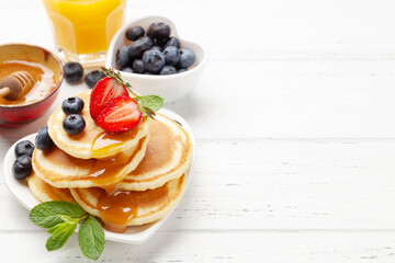 Healthy breakfast with pancakes and orange juice