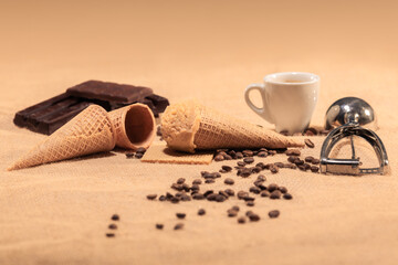 Almond ice cream with coffee beans, chocolate and ice cream scoop: Selective focus