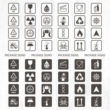 Vector packaging symbols on wood background. Shipping icon set including recycling, fragile, the shelf life of the product, flammable, non-toxic material, this side up, other symbols. Use on package.