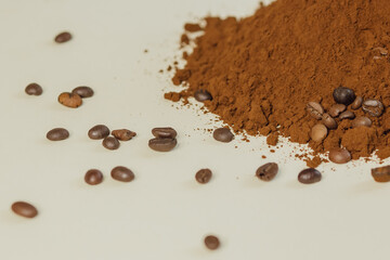 Coffee powder and roasted coffee beans on white background. 