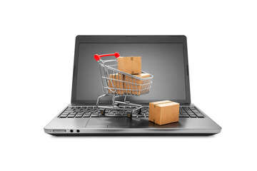 Cartons boxes in a shopping cart on a laptop keyboard