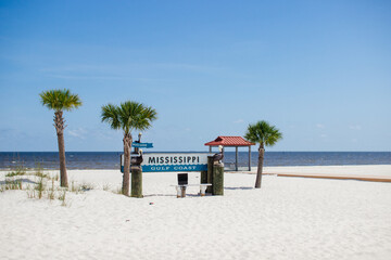 Beautiful summer landscape by the ocean with white sand and clear blue skies, palm trees and a...