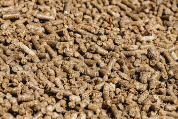 Pressed wood filler for pet toilet, background