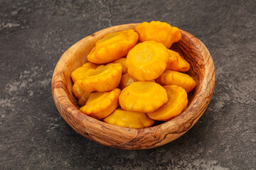 Marinated yellow patisson in the bowl