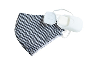 Fabric face mask black-white stripes and portable soap sheet isolated on a white background. Concept of coronavirus outbreak and pollution. New normal.