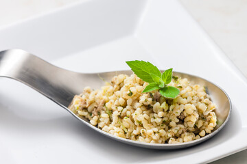 still life of bulgur salad with mint