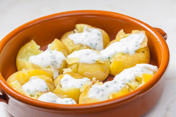baked potatoes with yoghurt sauce and chive