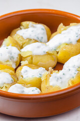 baked potatoes with yoghurt sauce and chive