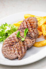 beef steak with homemade french fries and vegetable salad